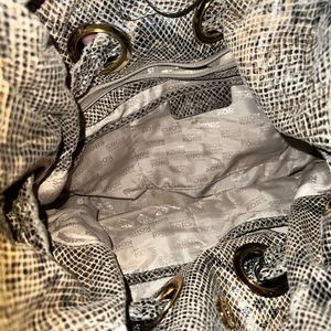 Michael kors Braided grommet snakeskin shoulder bag   👜 

In great condition.